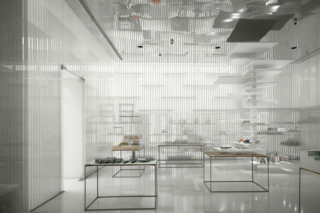 A calm reception area with a clear counter, simple seating and a clean floor.