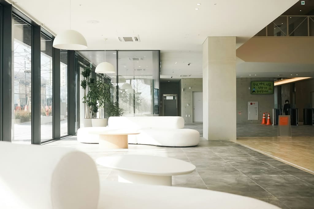 A bright, uncluttered modern office interior with clear surfaces and large windows.